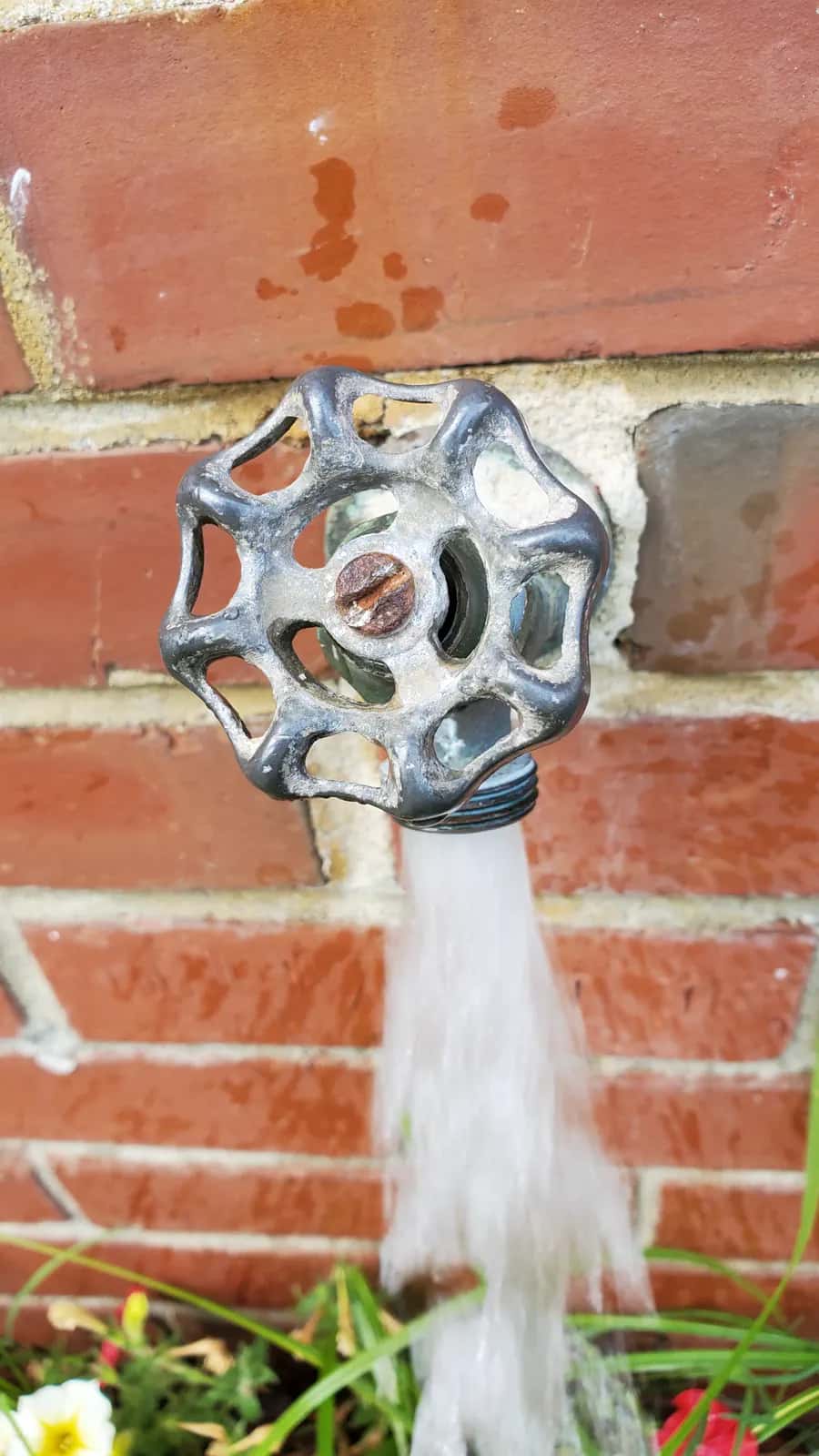 Outdoor hose bib plumbing repair close-up
