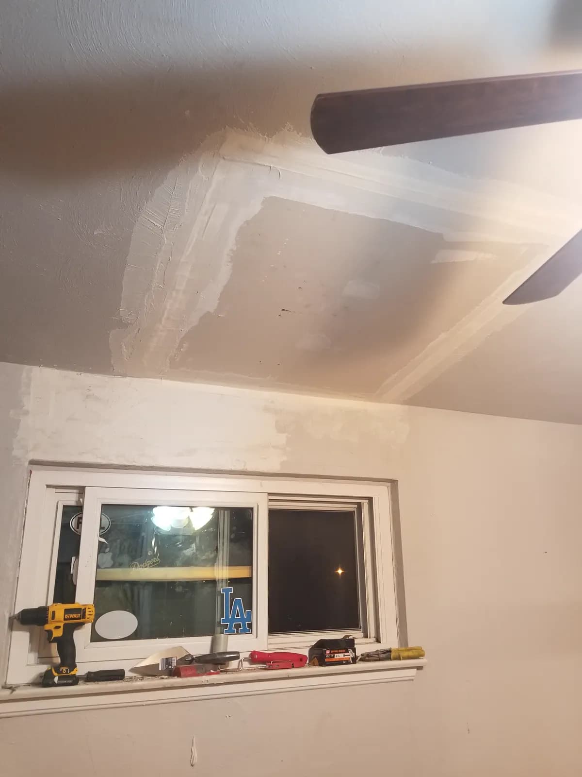 Drywall and window wall repair work in progress