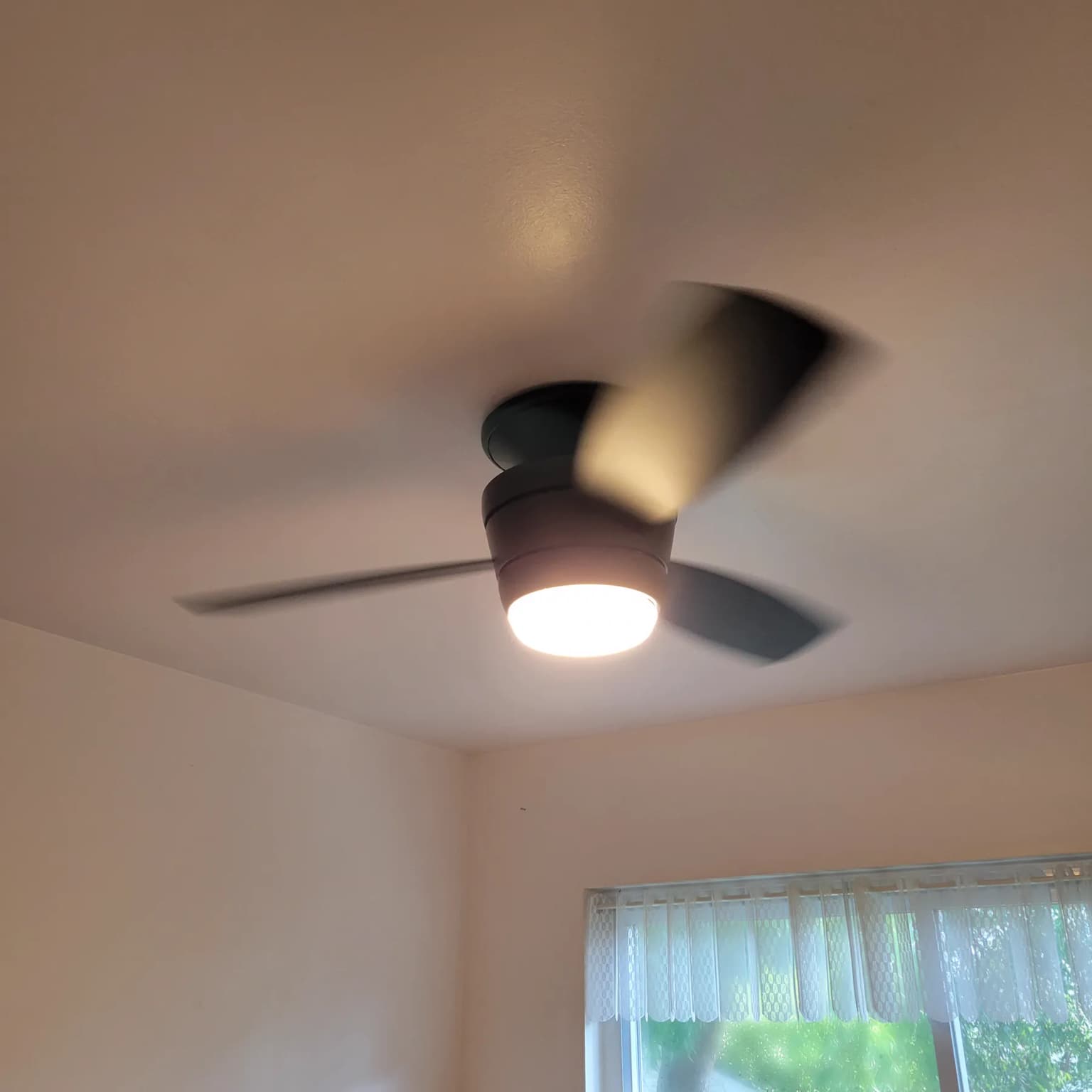 Exterior wall light fixture installed on siding