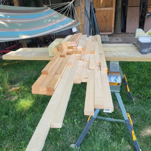 Fresh lumber staged for a full-day handyman project