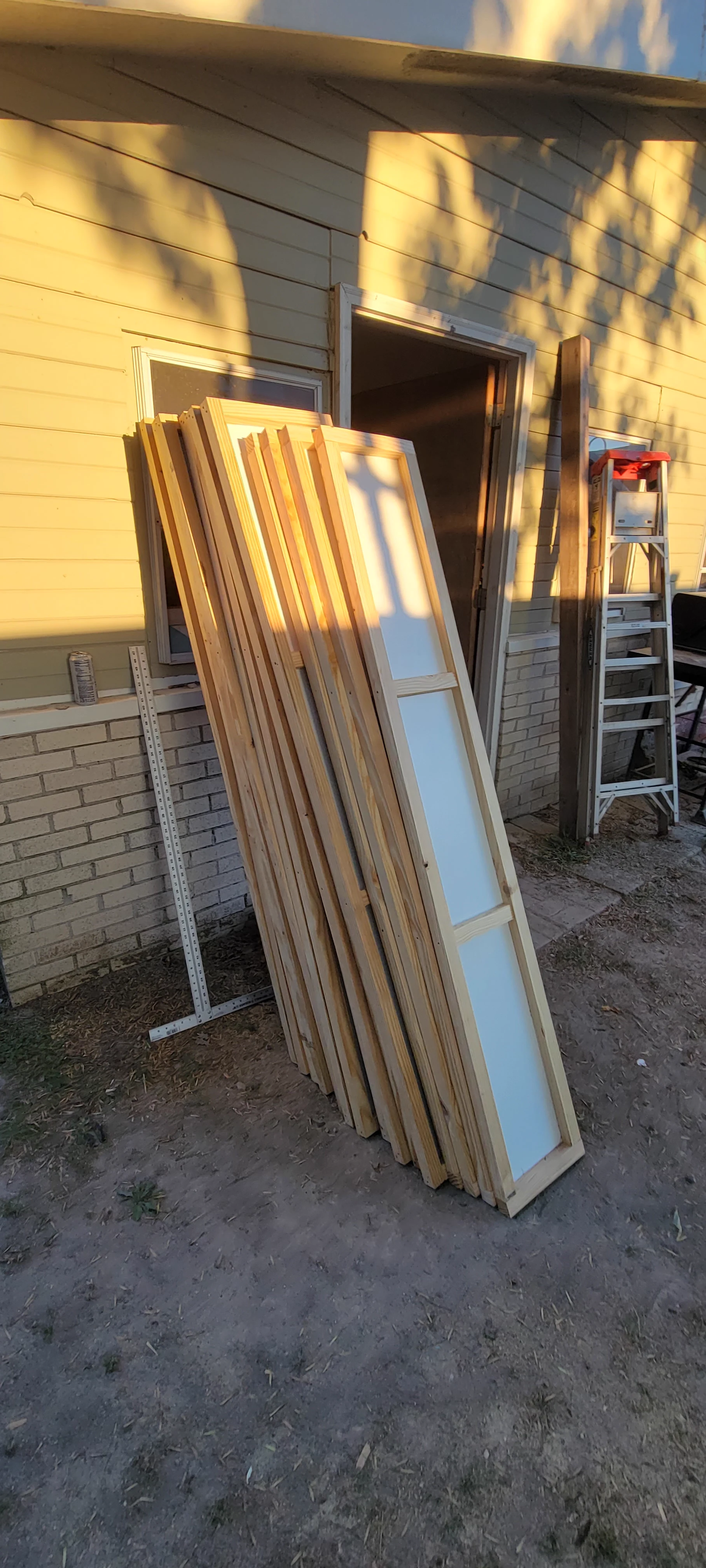 Trim boards and carpentry materials staged for repair work